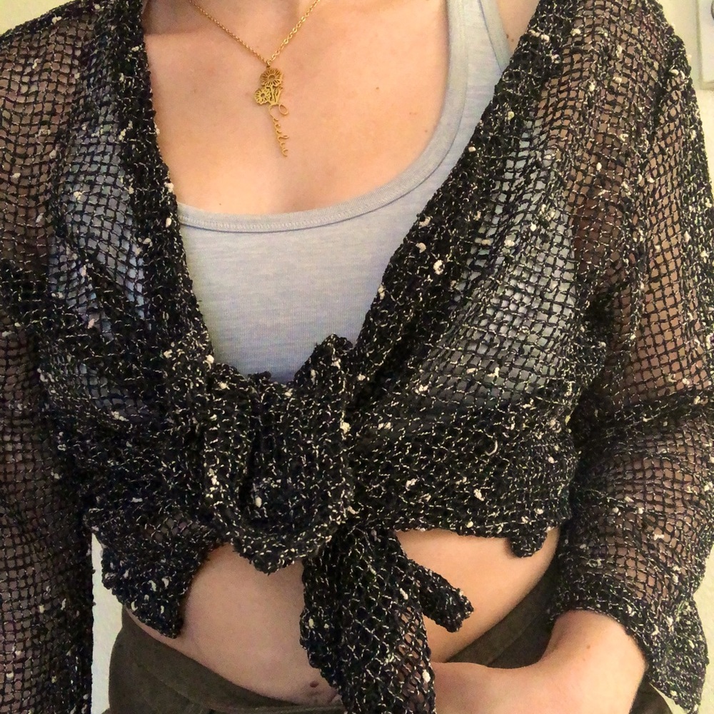 One size fits all vintage fishnet shrug. Can be worn as shawl or tied top.